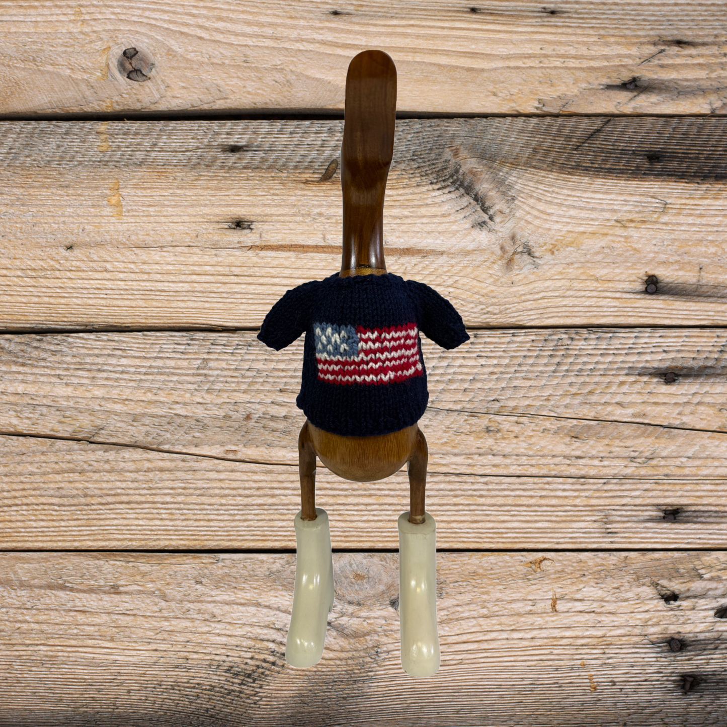 Hand-knit navy American flag duck sweater by COLLAB BY AMERICAN/HOLIDAY™, featuring detailed knit pattern and patriotic design.