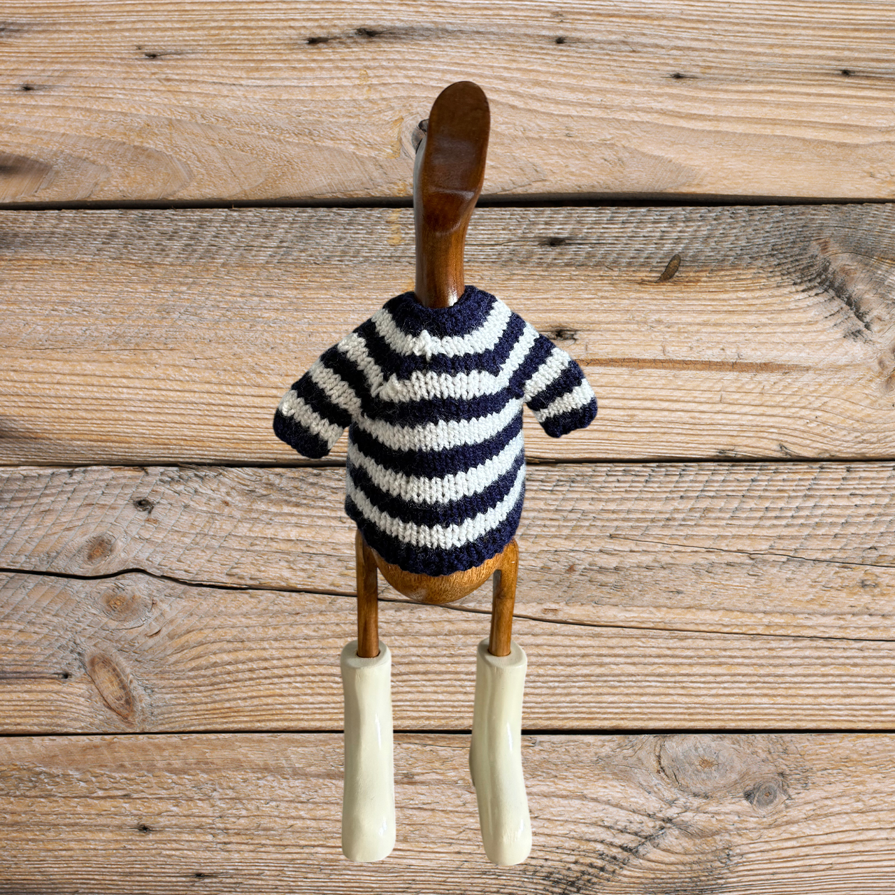 Hand-knit striped duck sweater by COLLAB BY AMERICAN/HOLIDAY™ featuring colorful knit patterns and a cozy fit.