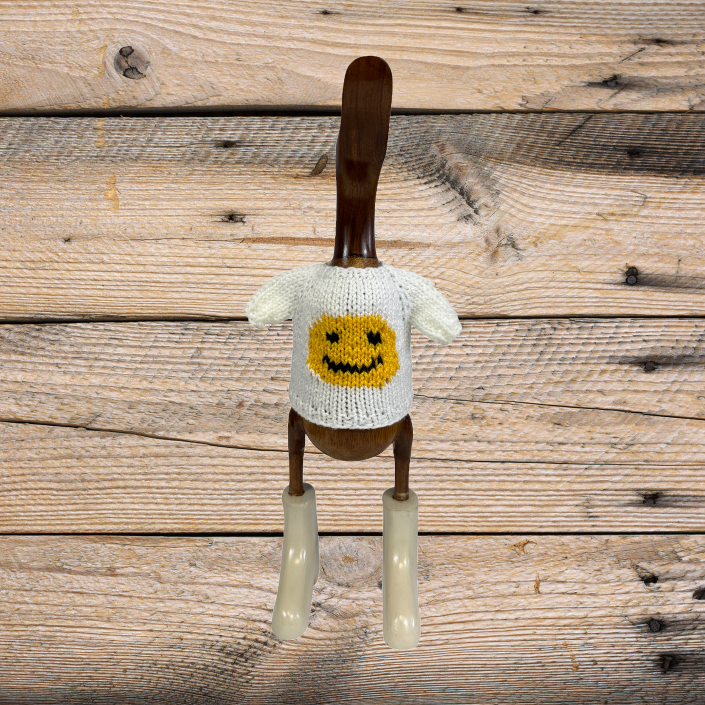 Hand-knit ivory sweater by COLLAB BY AMERICAN/HOLIDAY™ featuring yellow and black smiley face duck design