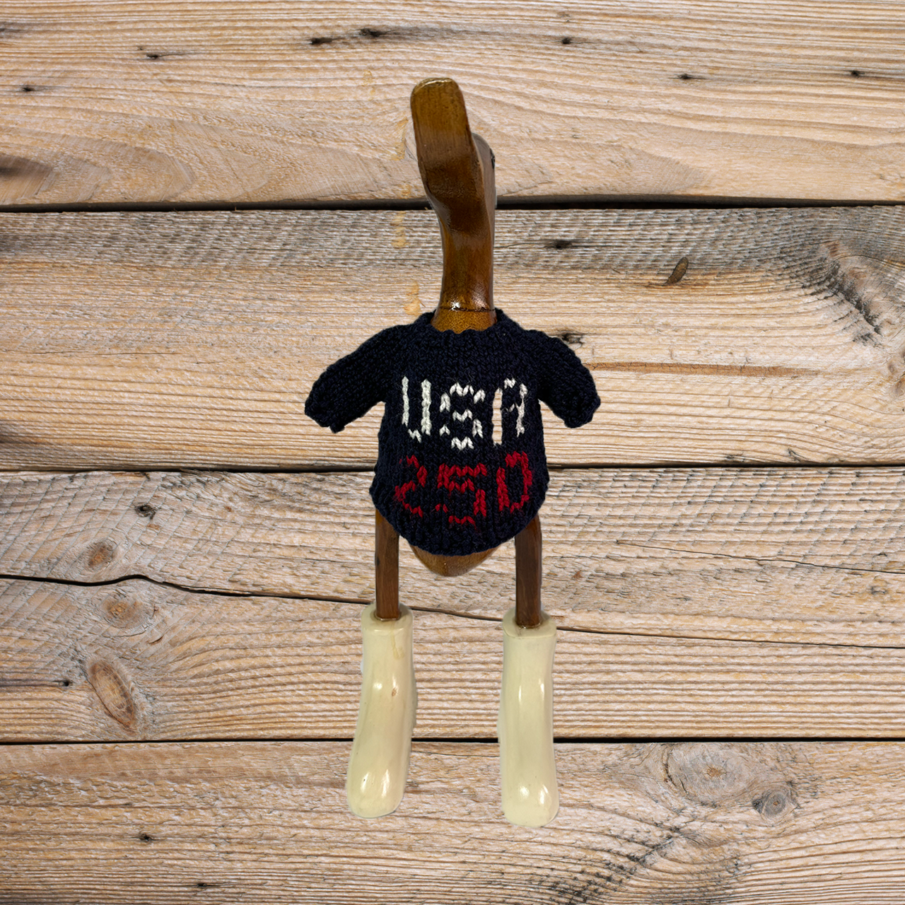 Hand-knit USA 250 Duck sweater by COLLAB BY AMERICAN/HOLIDAY™ featuring a cozy, textured duck pattern in vibrant colors.
